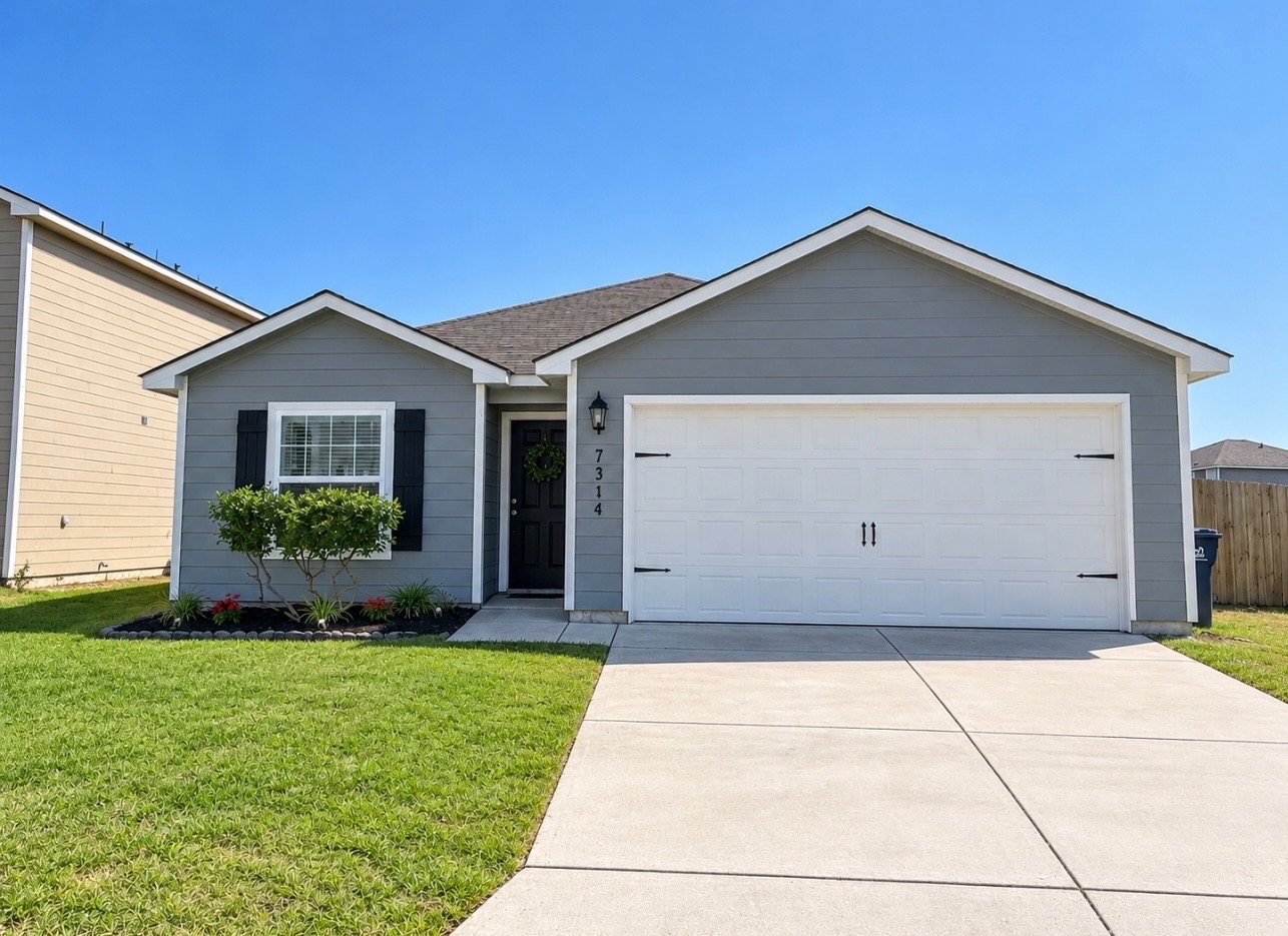 Front of the Valora home at 7314 Bowdre with a landscaped front yard